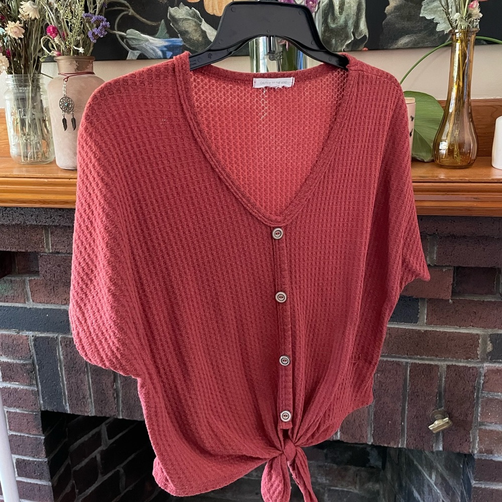 Caution to the Wind burnt-orange top! Size medium. Little snag (see last photo)